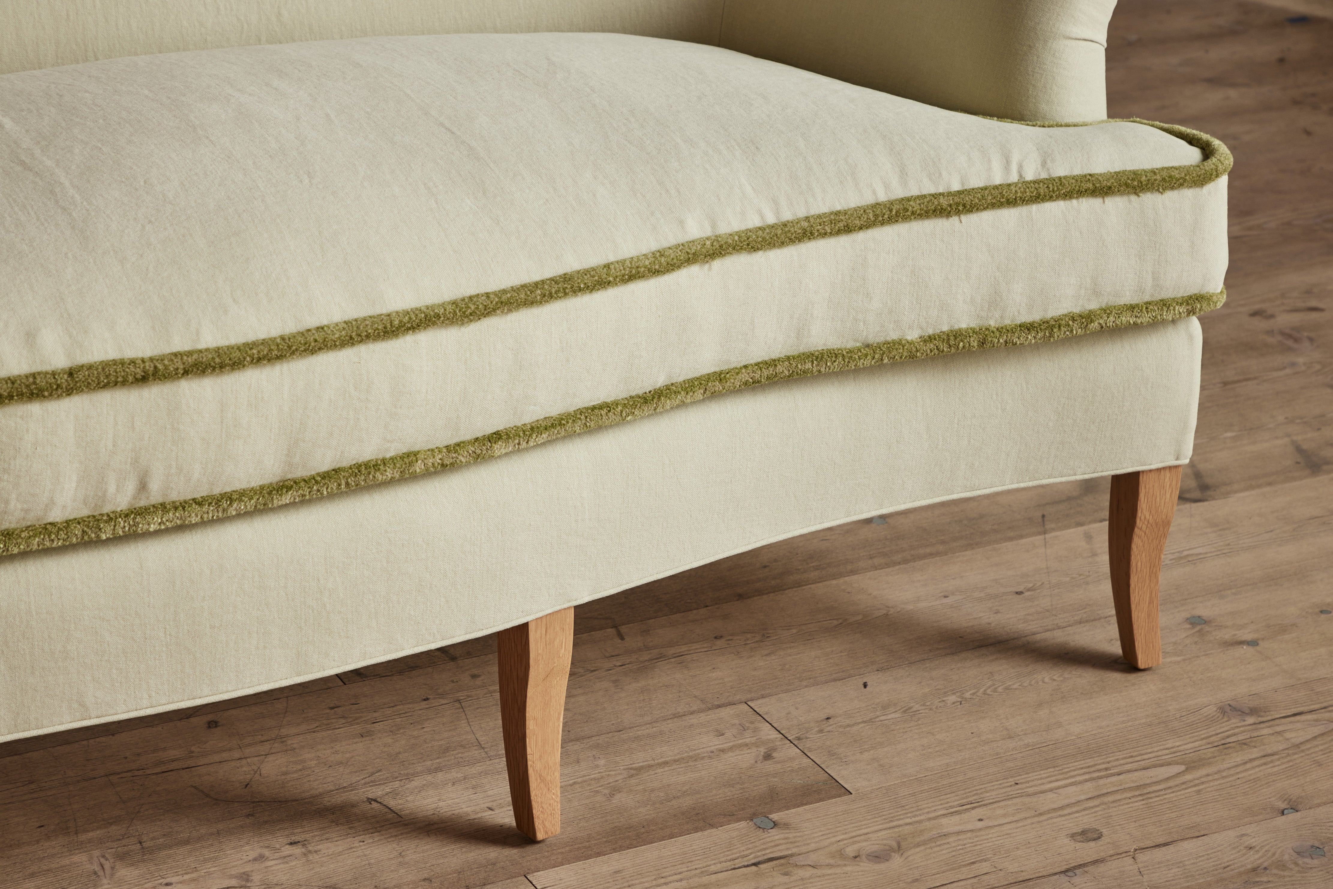 Shown in Customer's Own Material (Libeco, Stonewashed Linen Celadon with Samuel and Sons, Strata Marabout 10 Pear Trim) and Natural Oak