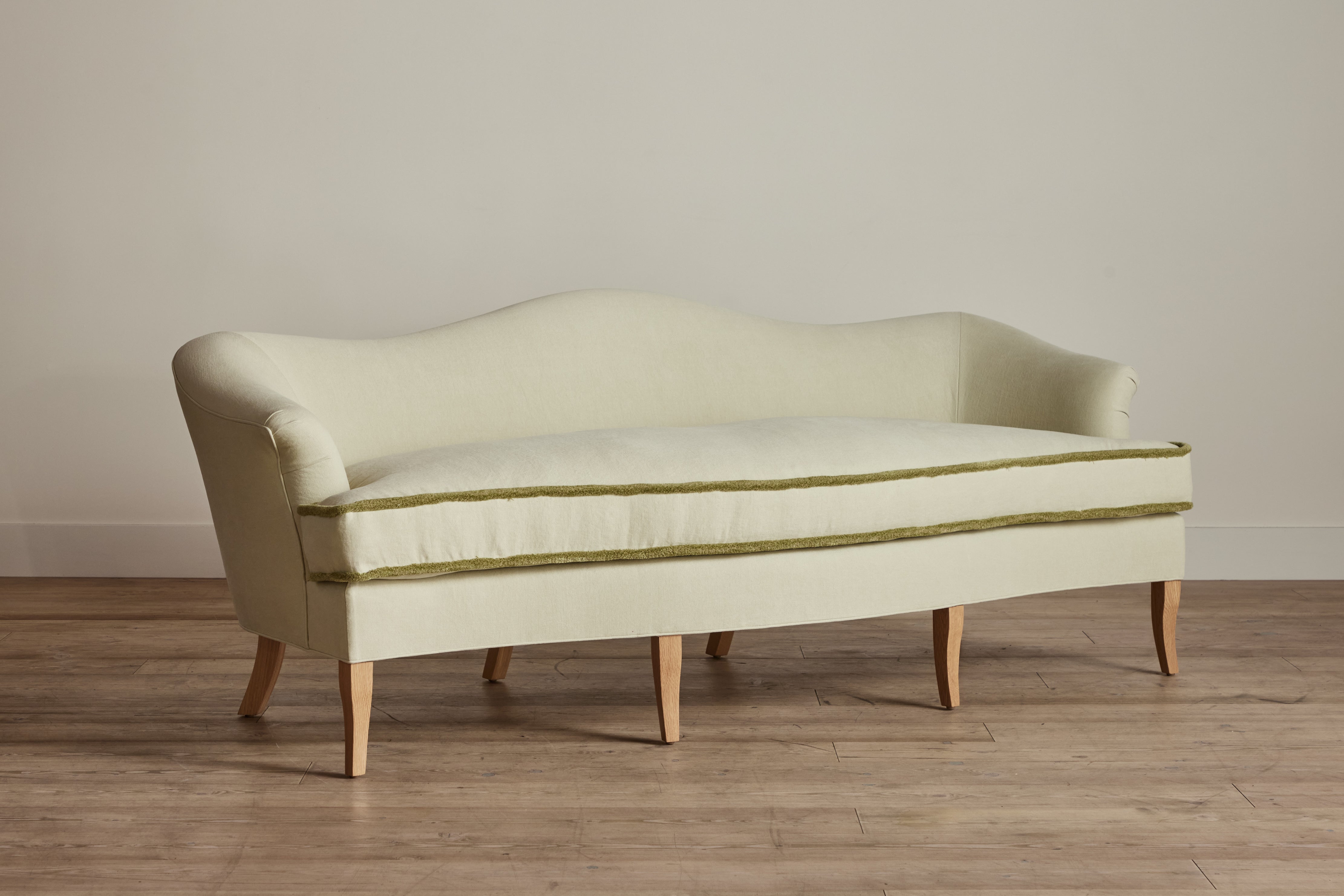 Shown in Customer's Own Material (Libeco, Stonewashed Linen Celadon with Samuel and Sons, Strata Marabout 10 Pear Trim) and Natural Oak
