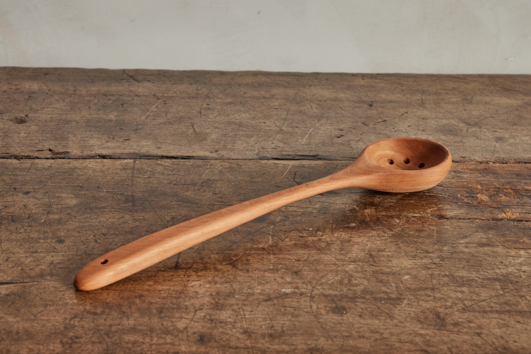 Cherry Wood Rounded Slotted Spoon - Nickey Kehoe