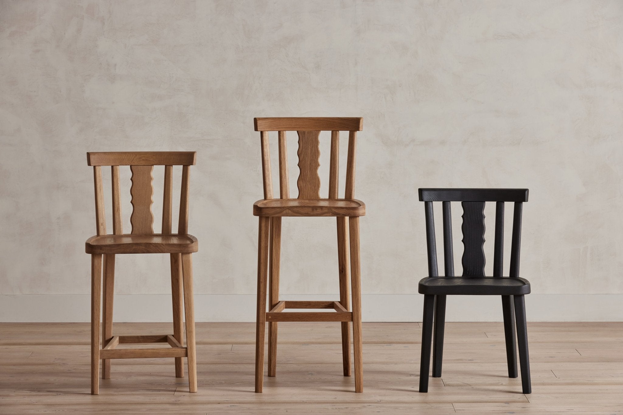 Shown in Natural Oak in Counter Stool, Natural Oak in Bar Stool, and Ebony in Dining Chair
