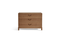 A wooden 3-drawer chest with brass handles, finished in natural oak tone; three drawers stacked vertically on a short legged base.