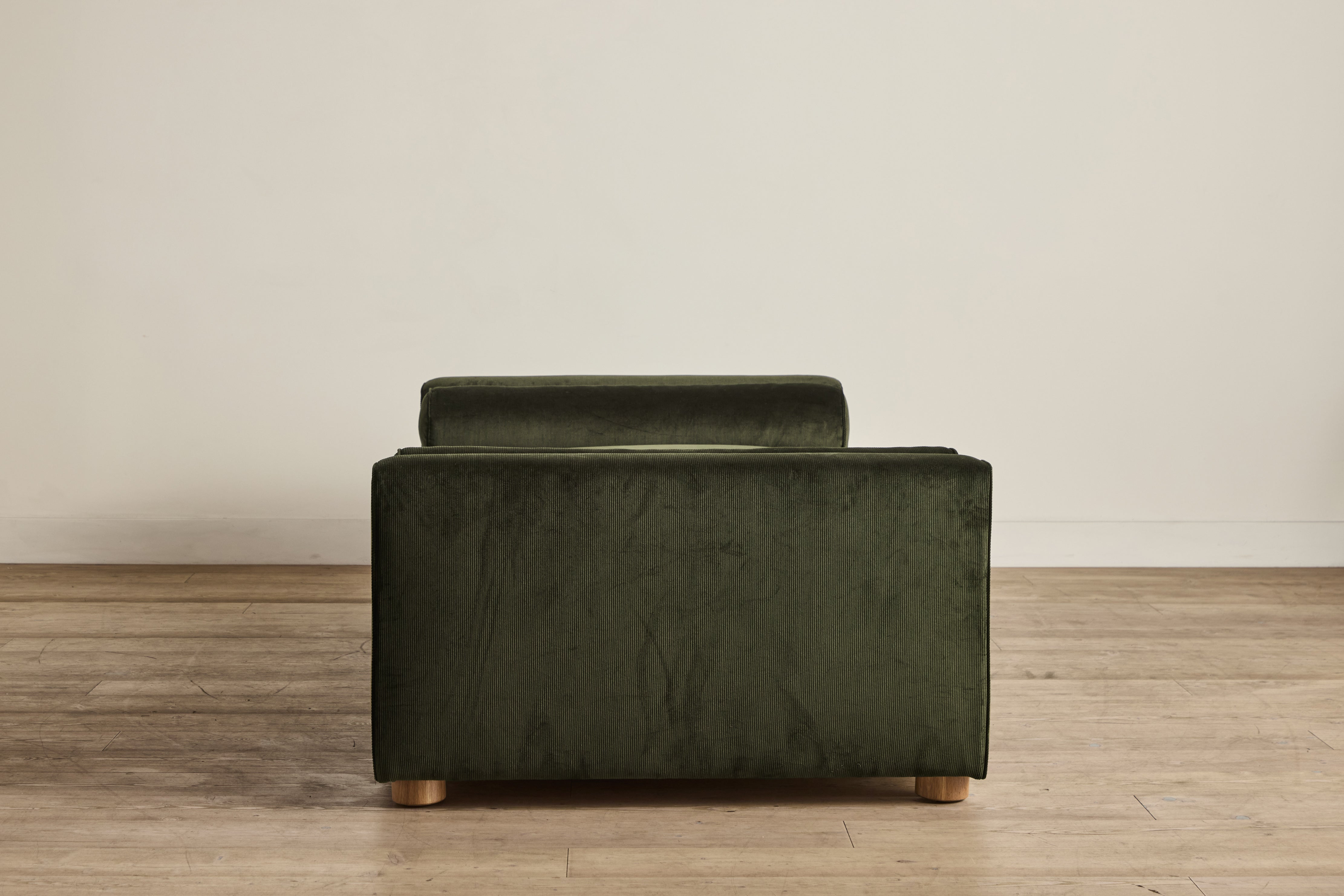 Shown in Holland & Sherry Dark Olive Corduroy and Natural Oak 