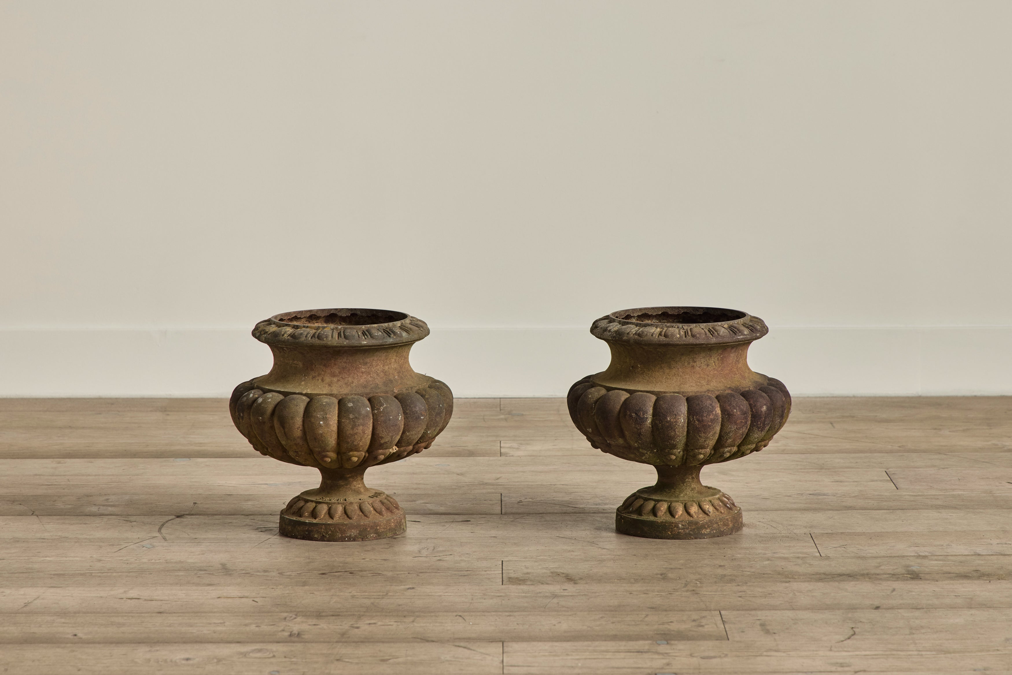 Pair of Cast Iron Urns