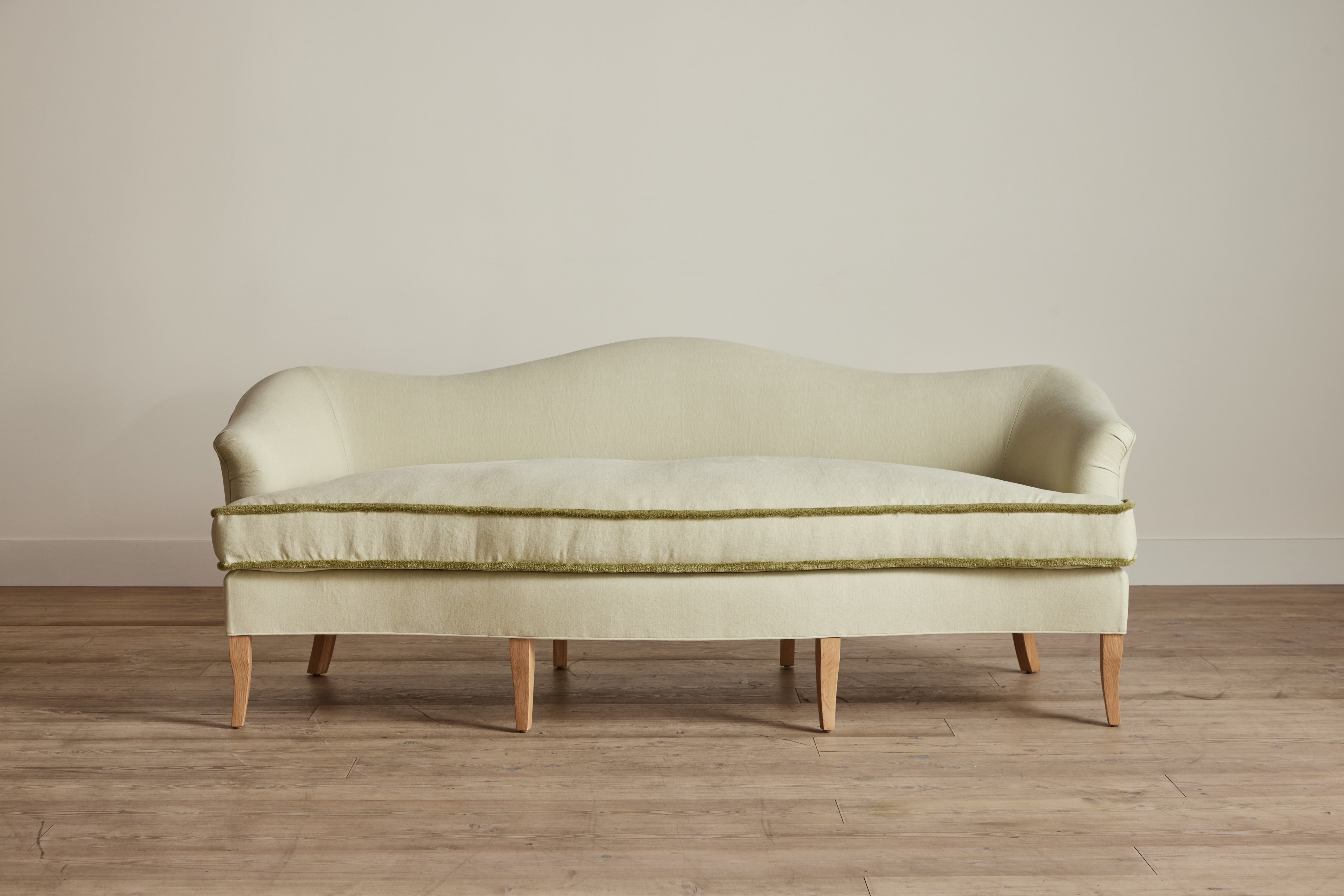Shown in Customer's Own Material (Libeco, Stonewashed Linen Celadon with Samuel and Sons, Strata Marabout 10 Pear Trim) and Natural Oak