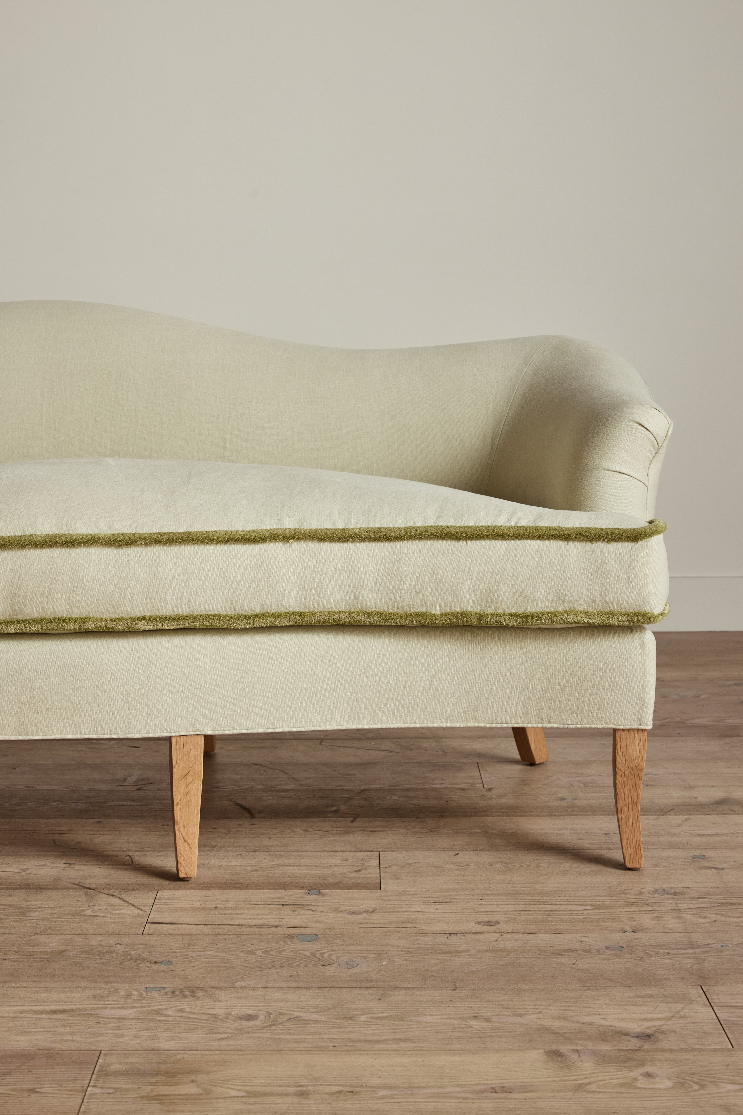 Shown in Customer's Own Material (Libeco, Stonewashed Linen Celadon with Samuel and Sons, Strata Marabout 10 Pear Trim) and Natural Oak