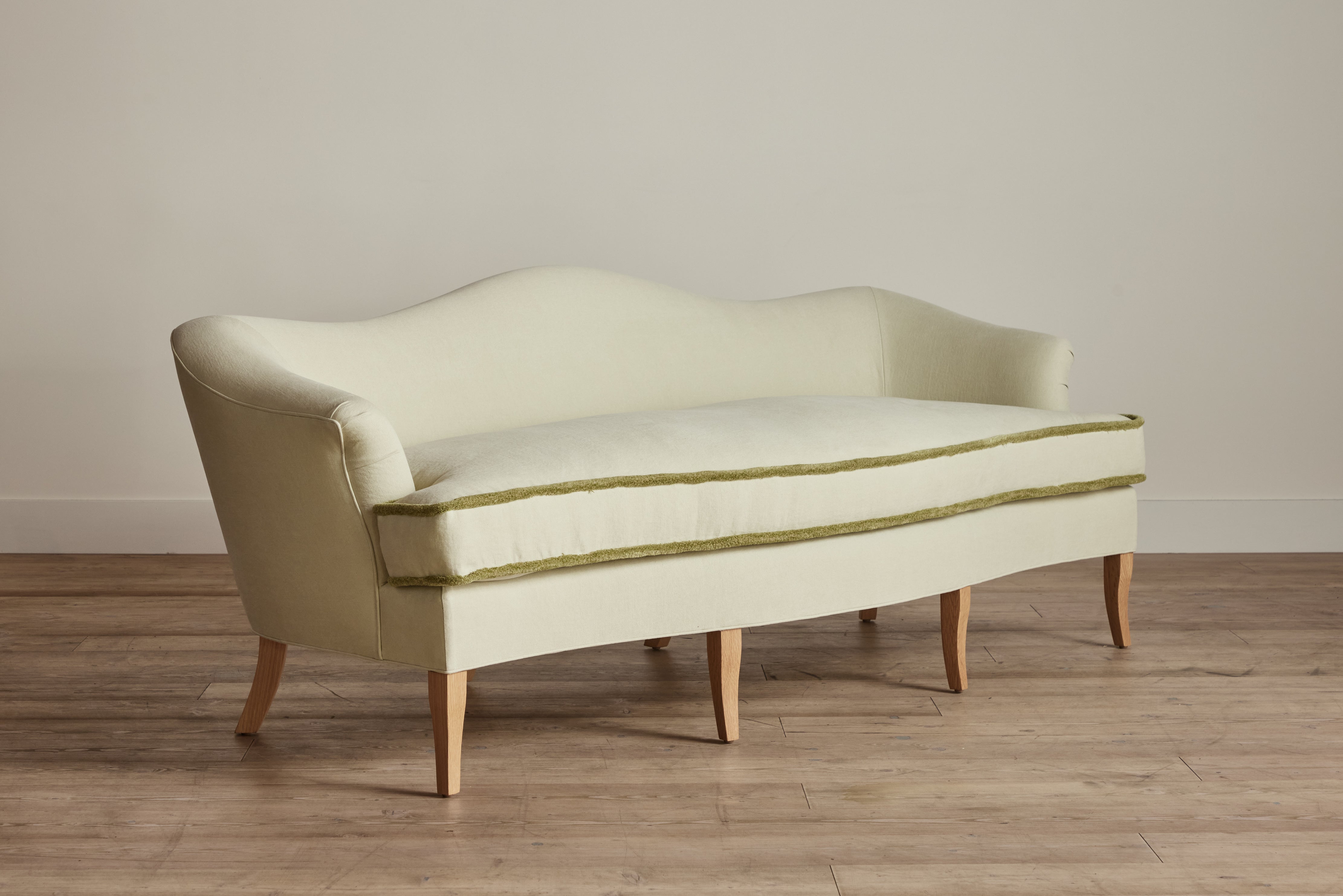 Shown in Customer's Own Material (Libeco, Stonewashed Linen Celadon with Samuel and Sons, Strata Marabout 10 Pear Trim) and Natural Oak
