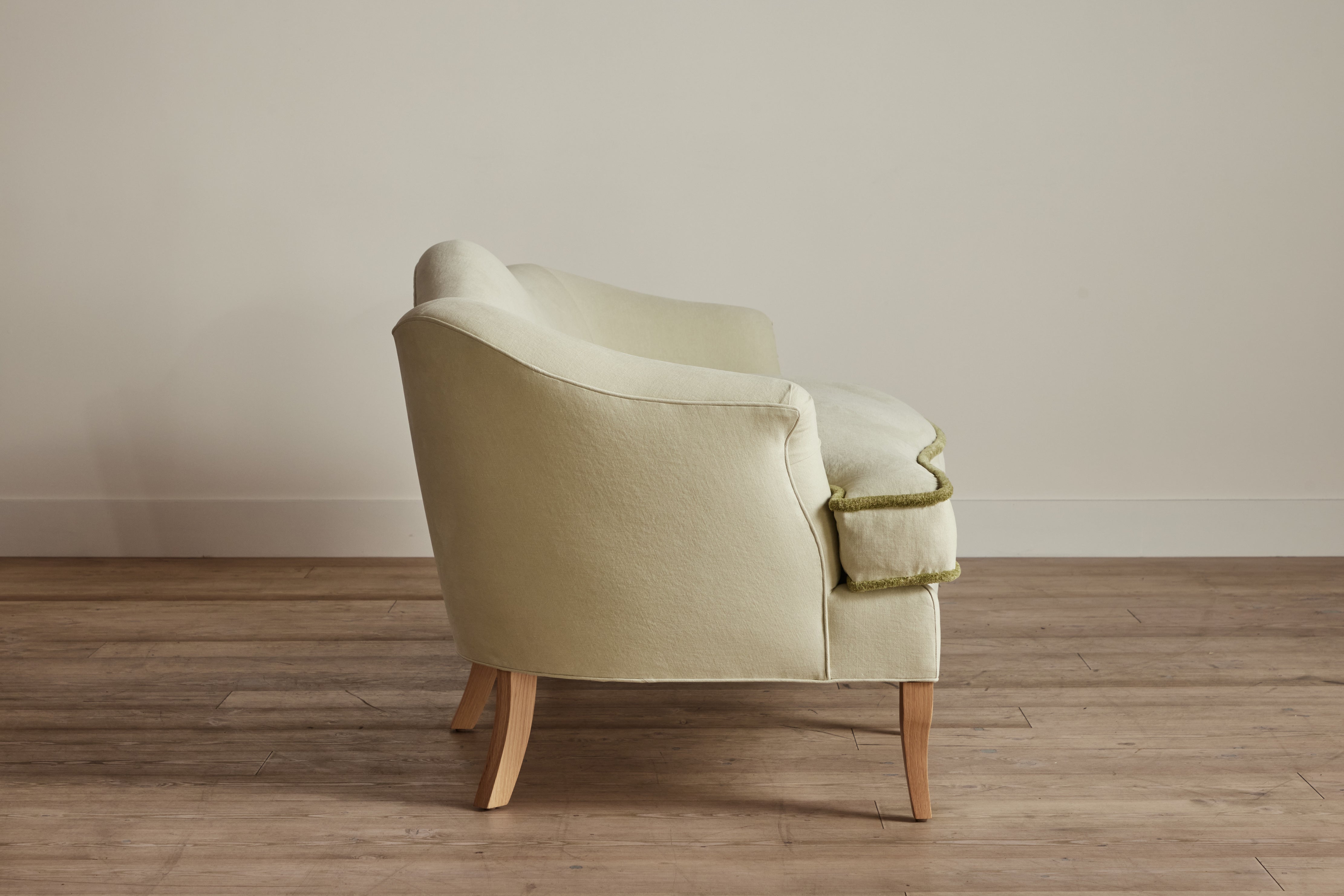Shown in Customer's Own Material (Libeco, Stonewashed Linen Celadon with Samuel and Sons, Strata Marabout 10 Pear Trim) and Natural Oak
