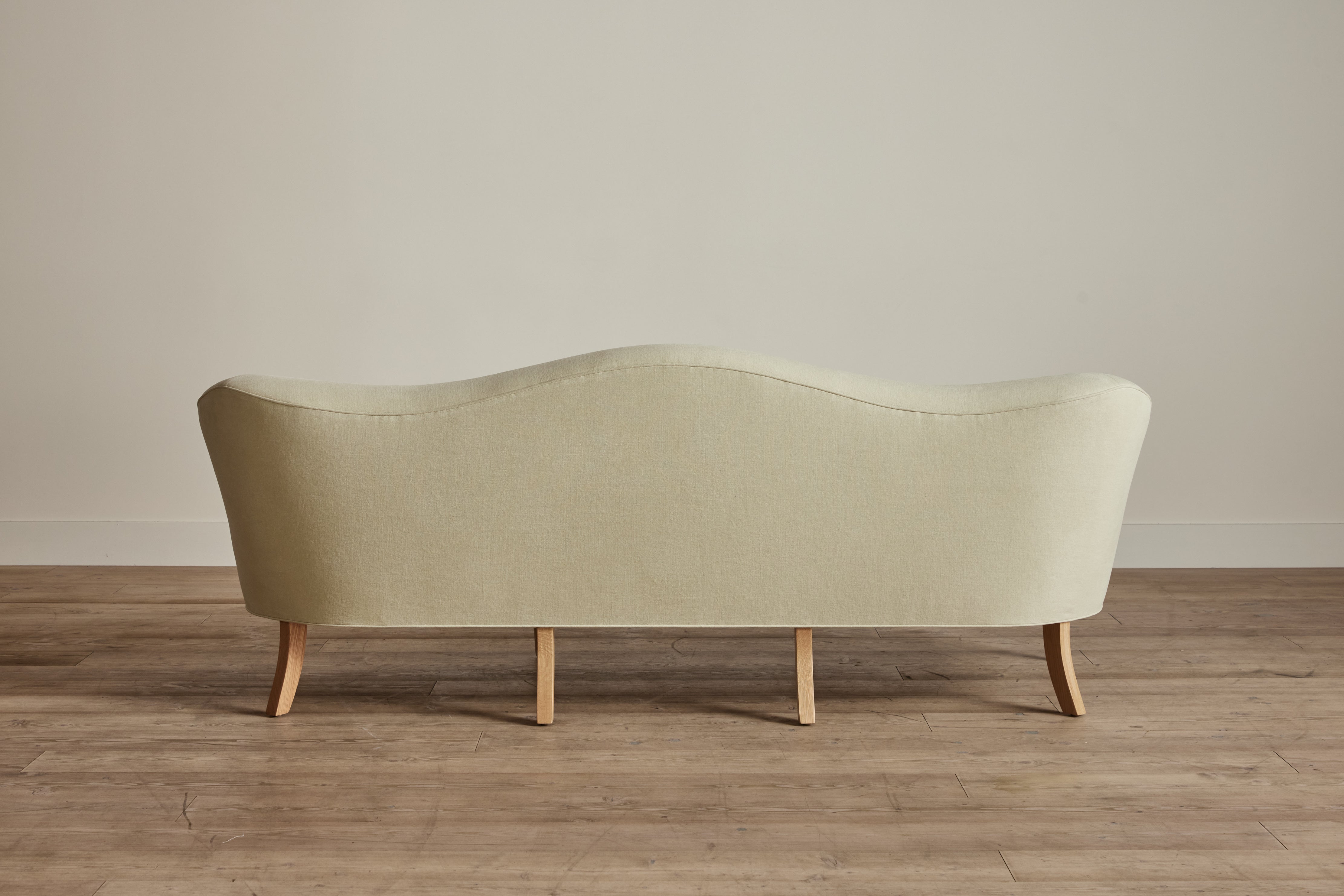 Shown in Customer's Own Material (Libeco, Stonewashed Linen Celadon with Samuel and Sons, Strata Marabout 10 Pear Trim) and Natural Oak