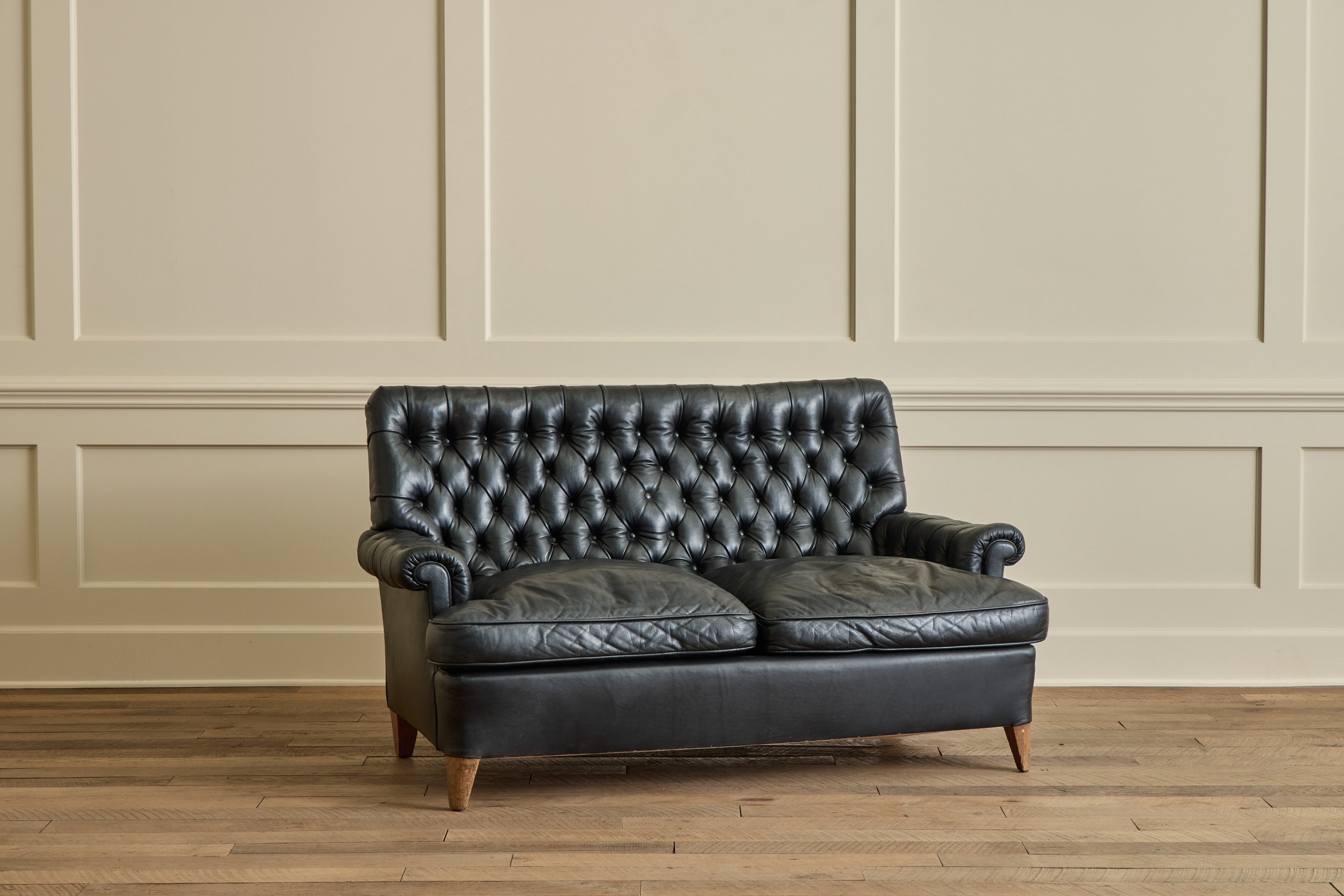 Black Leather Tufted Sofa