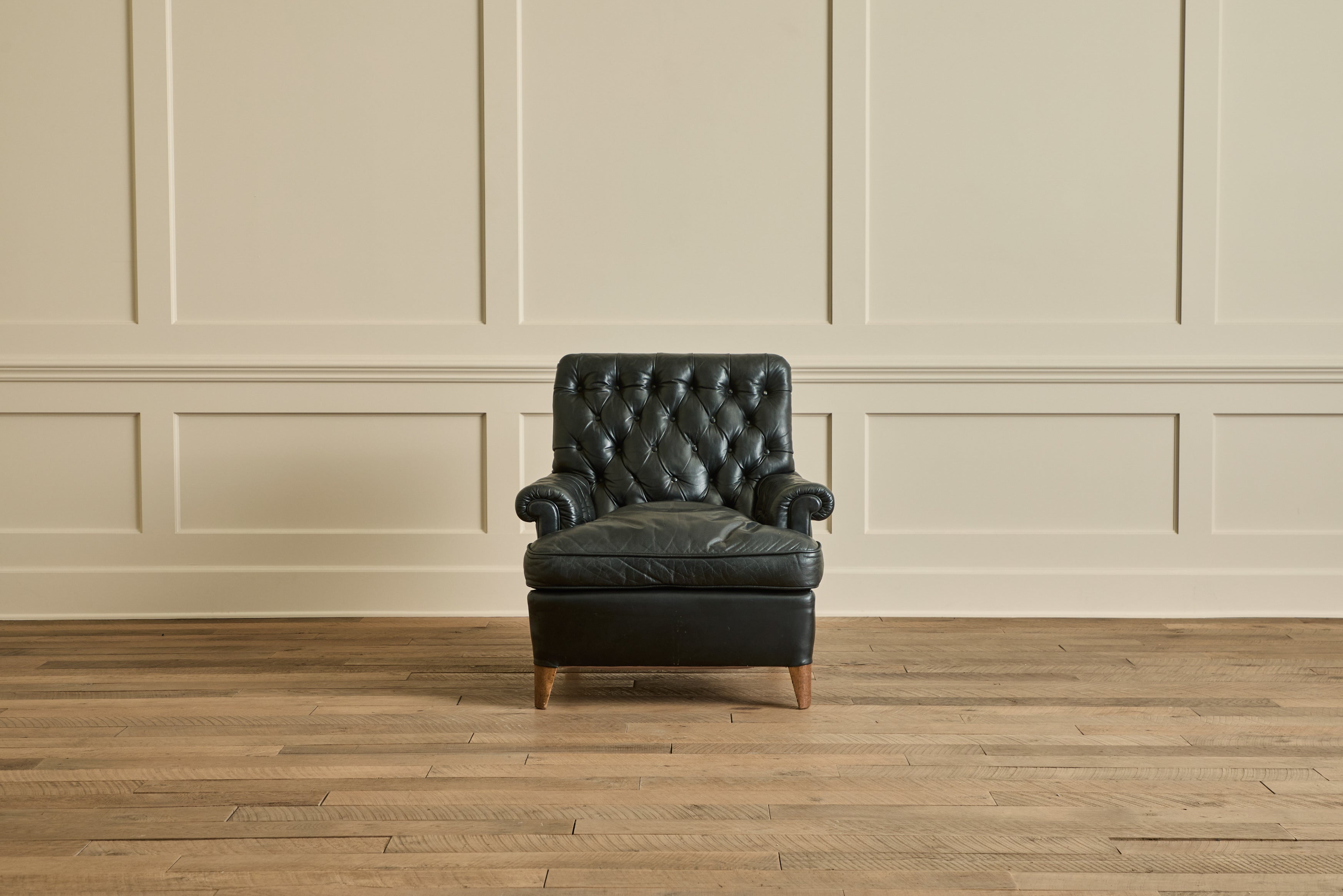 Pair of Tufted Black Leather Chairs
