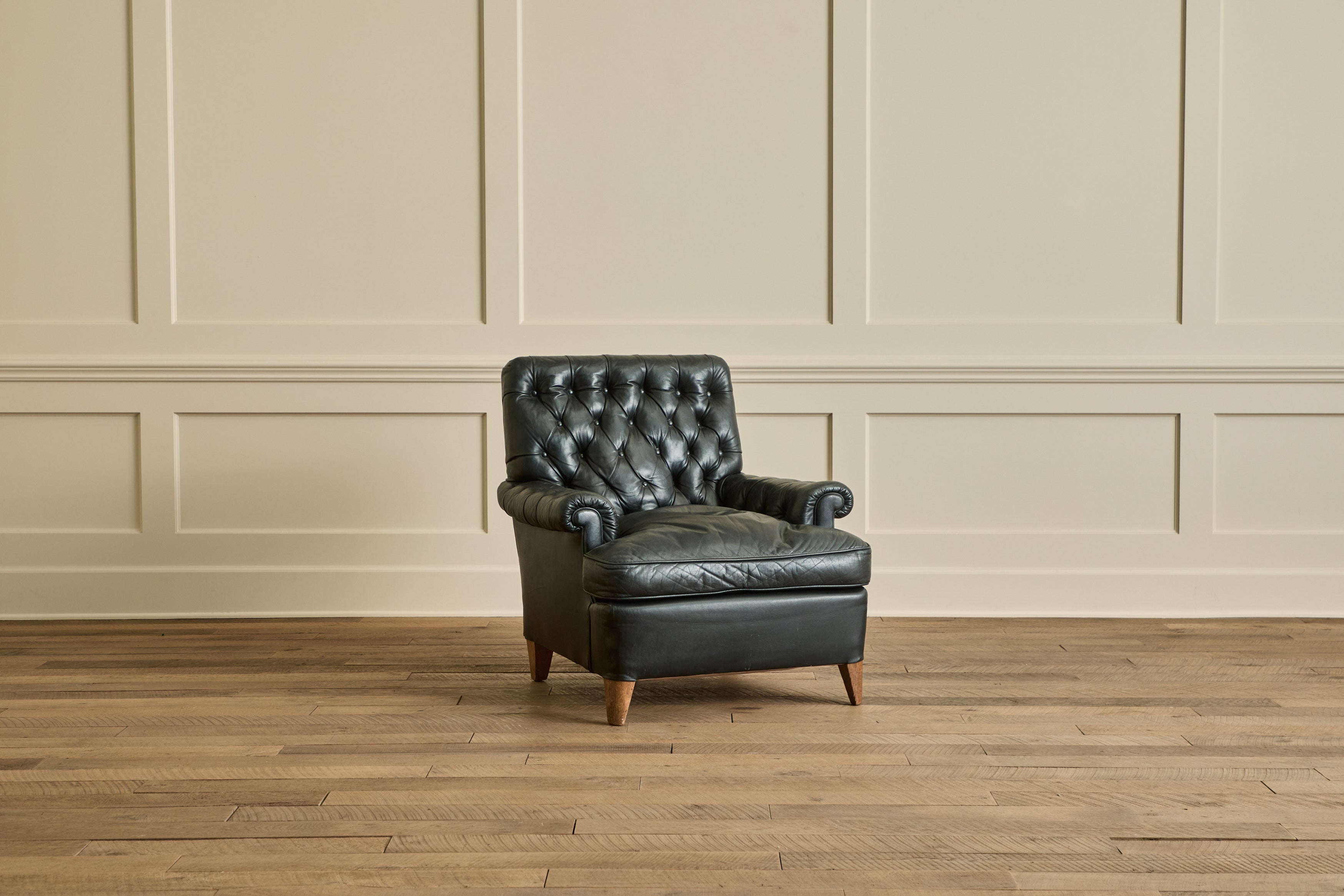 Pair of Tufted Black Leather Chairs