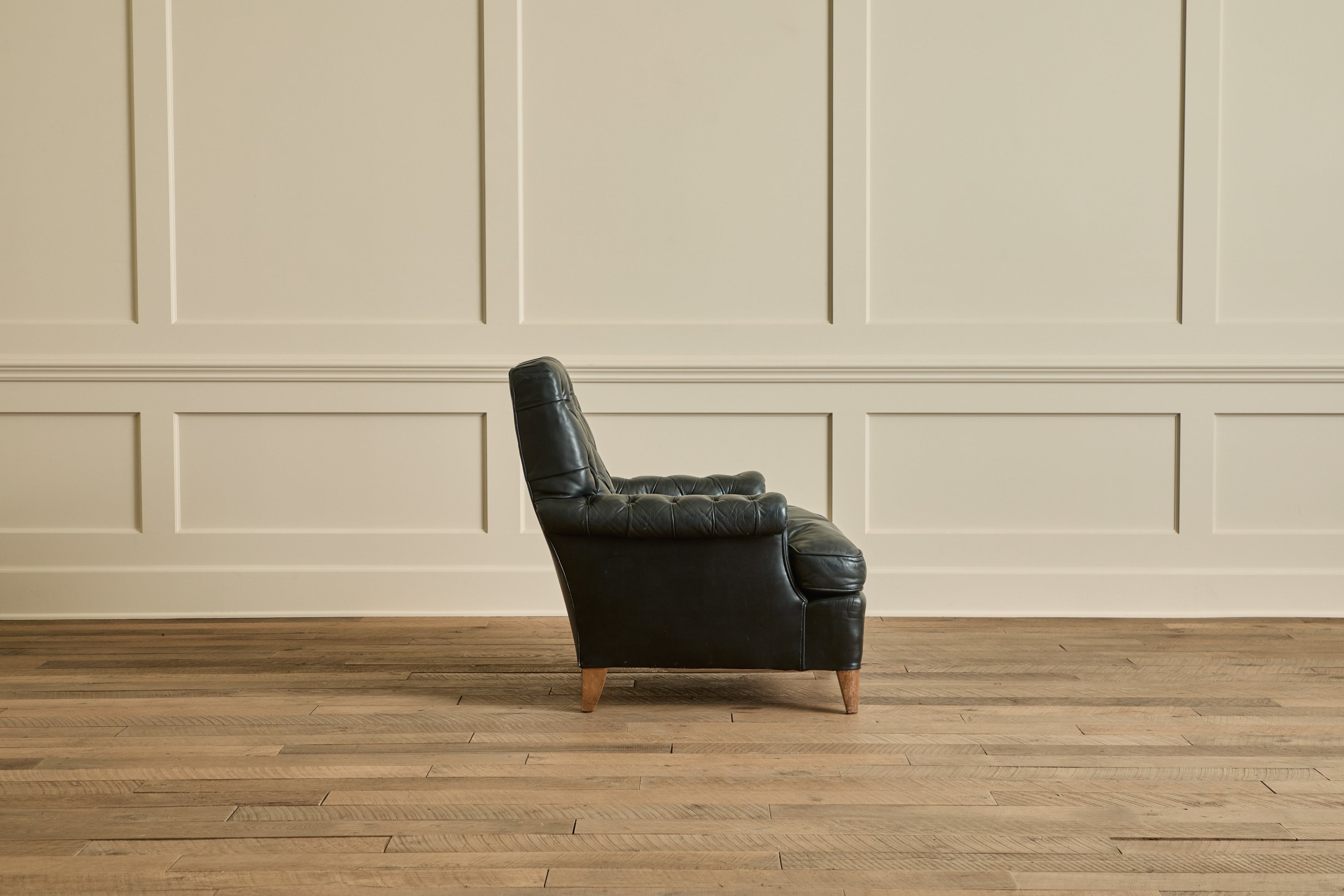 Pair of Tufted Black Leather Chairs