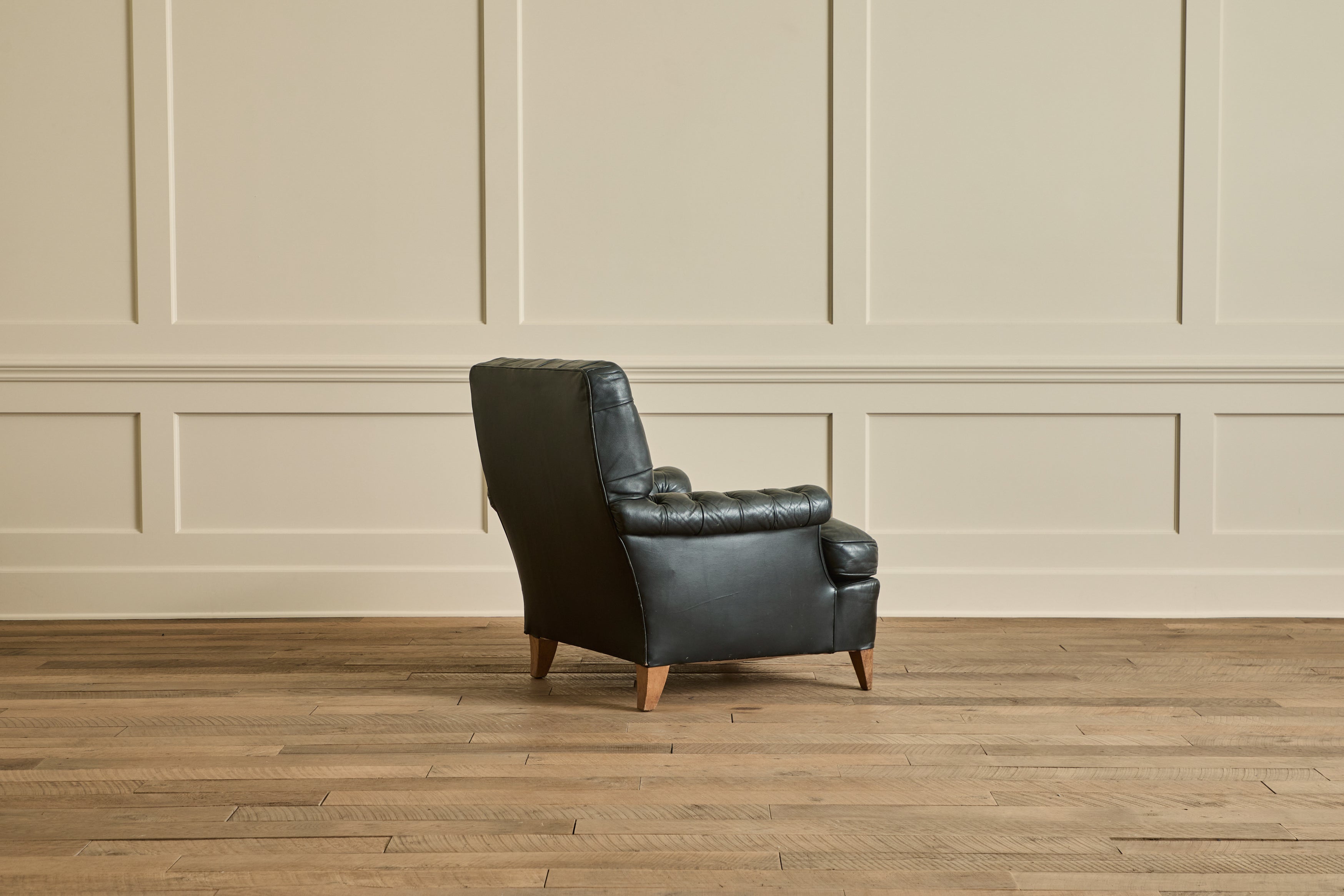 Pair of Tufted Black Leather Chairs