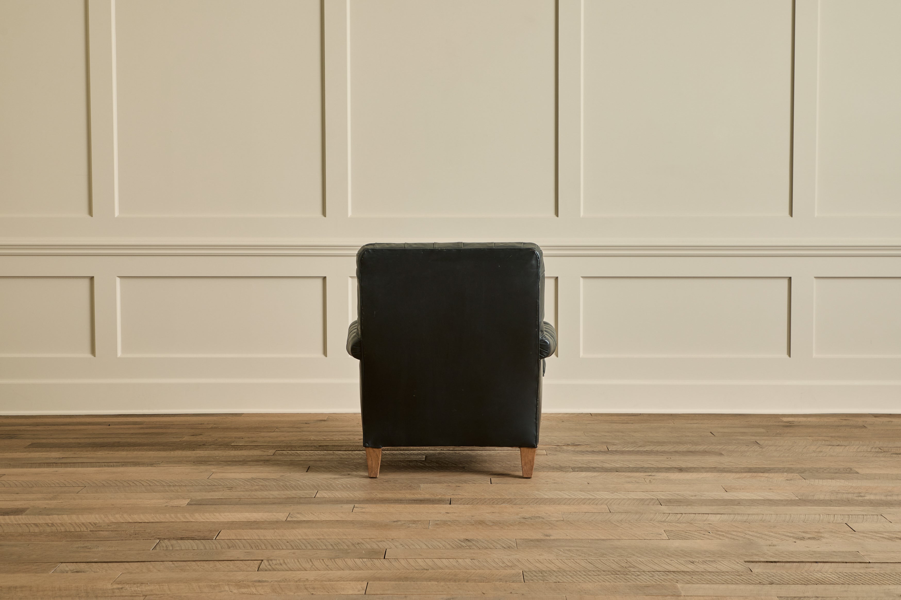 Pair of Tufted Black Leather Chairs