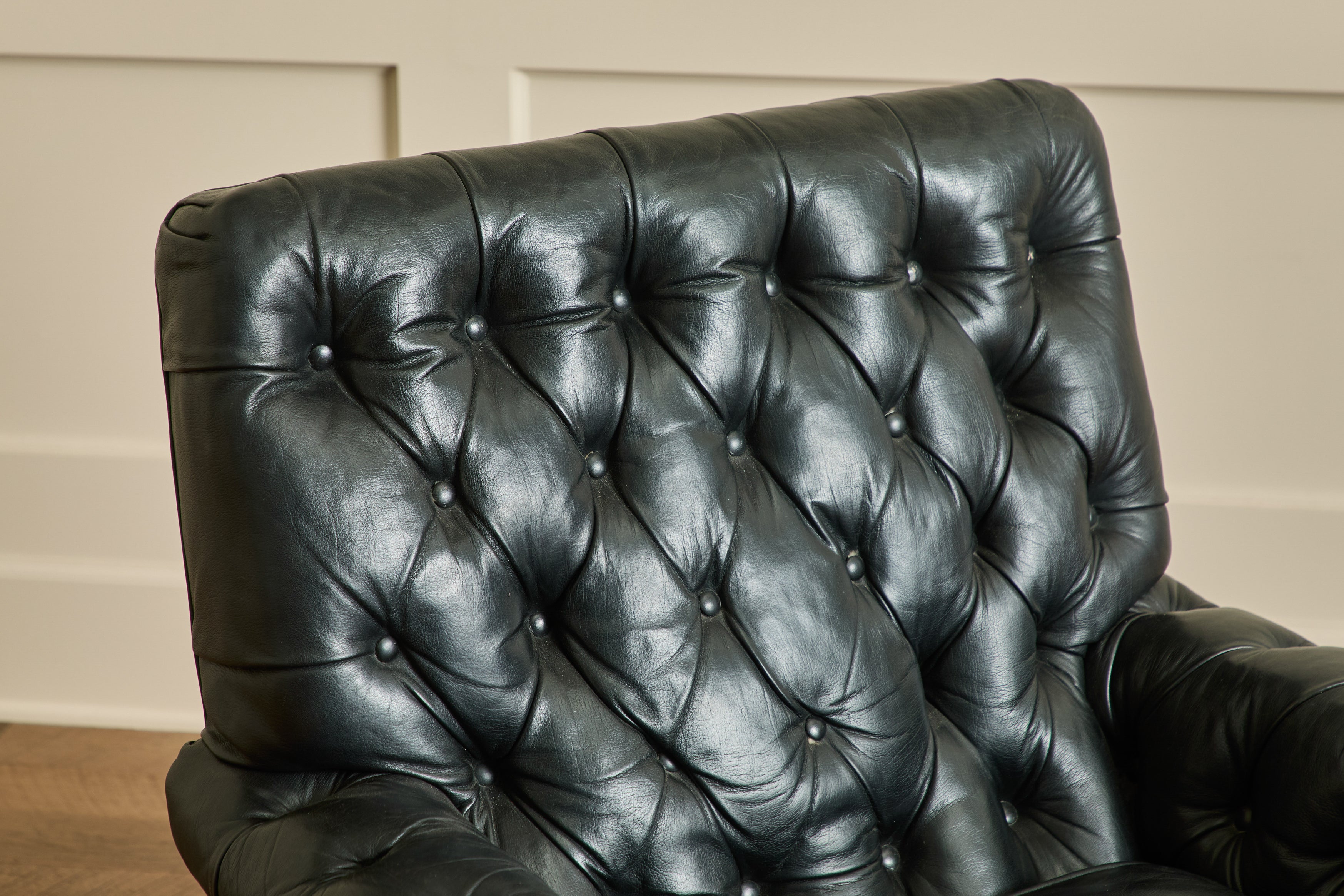 Pair of Tufted Black Leather Chairs
