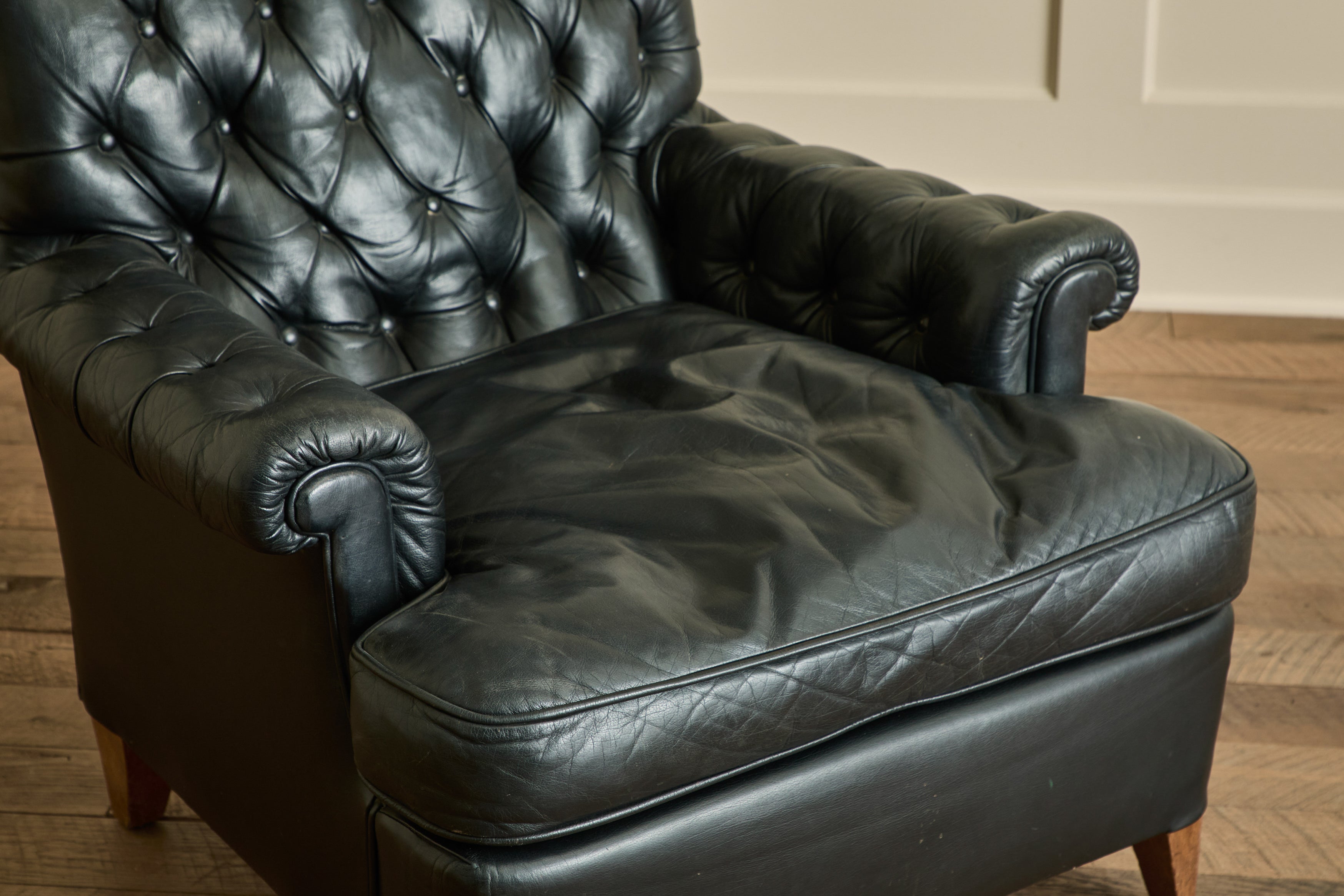 Pair of Tufted Black Leather Chairs