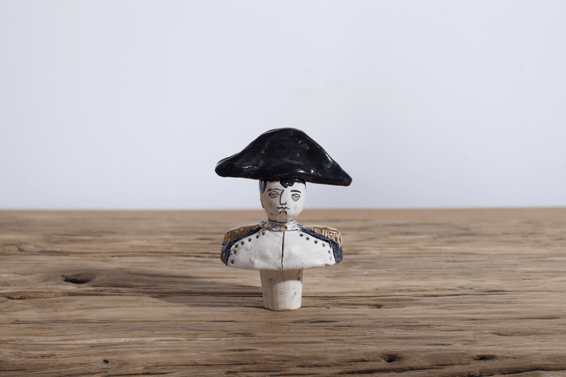 One Napoleon Wine Stopper.